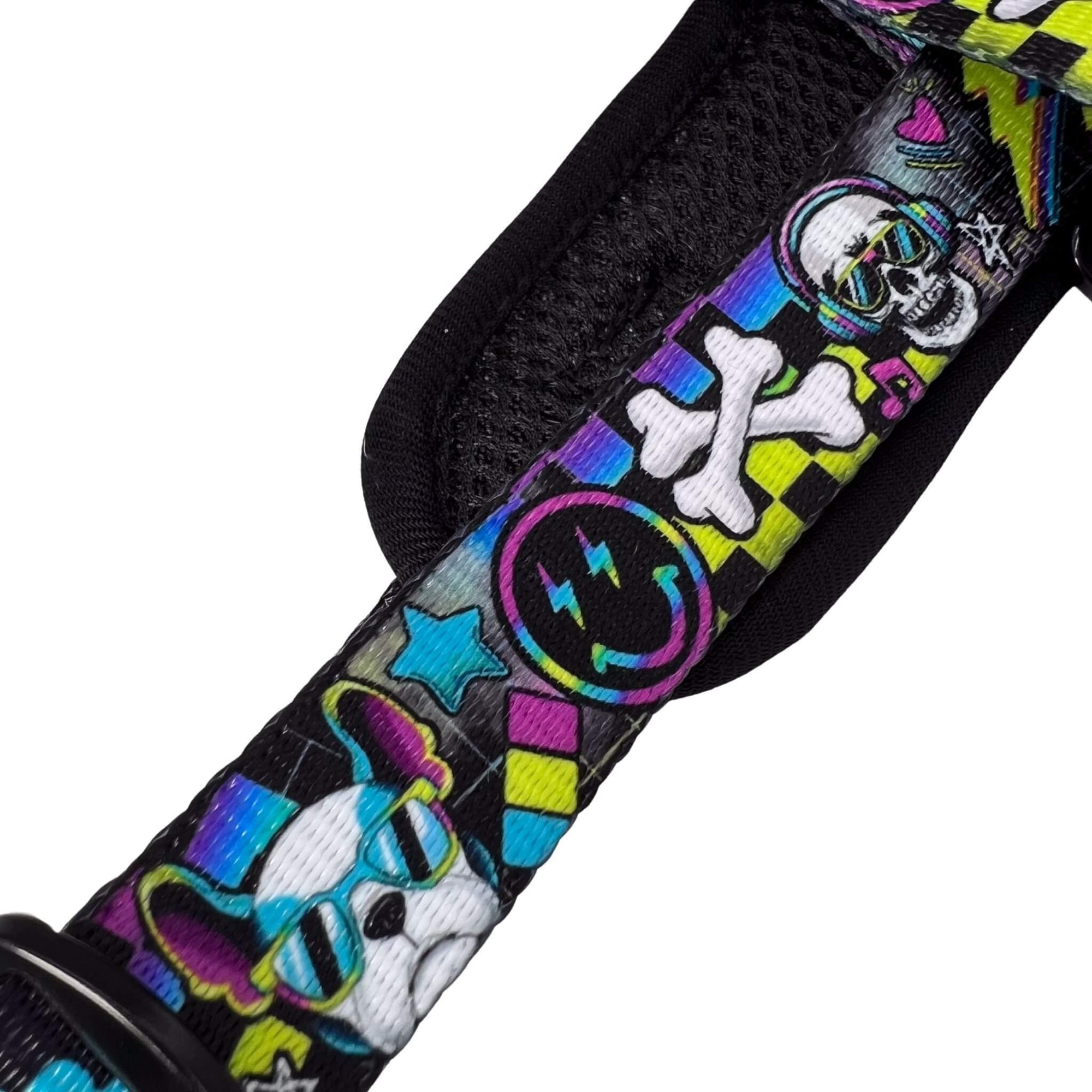 No Pull Dog Harness - Skull Society with multicolored graphics in yellow, blue, purple with black background - closeup of strap - against solid white background - Wag Trendz