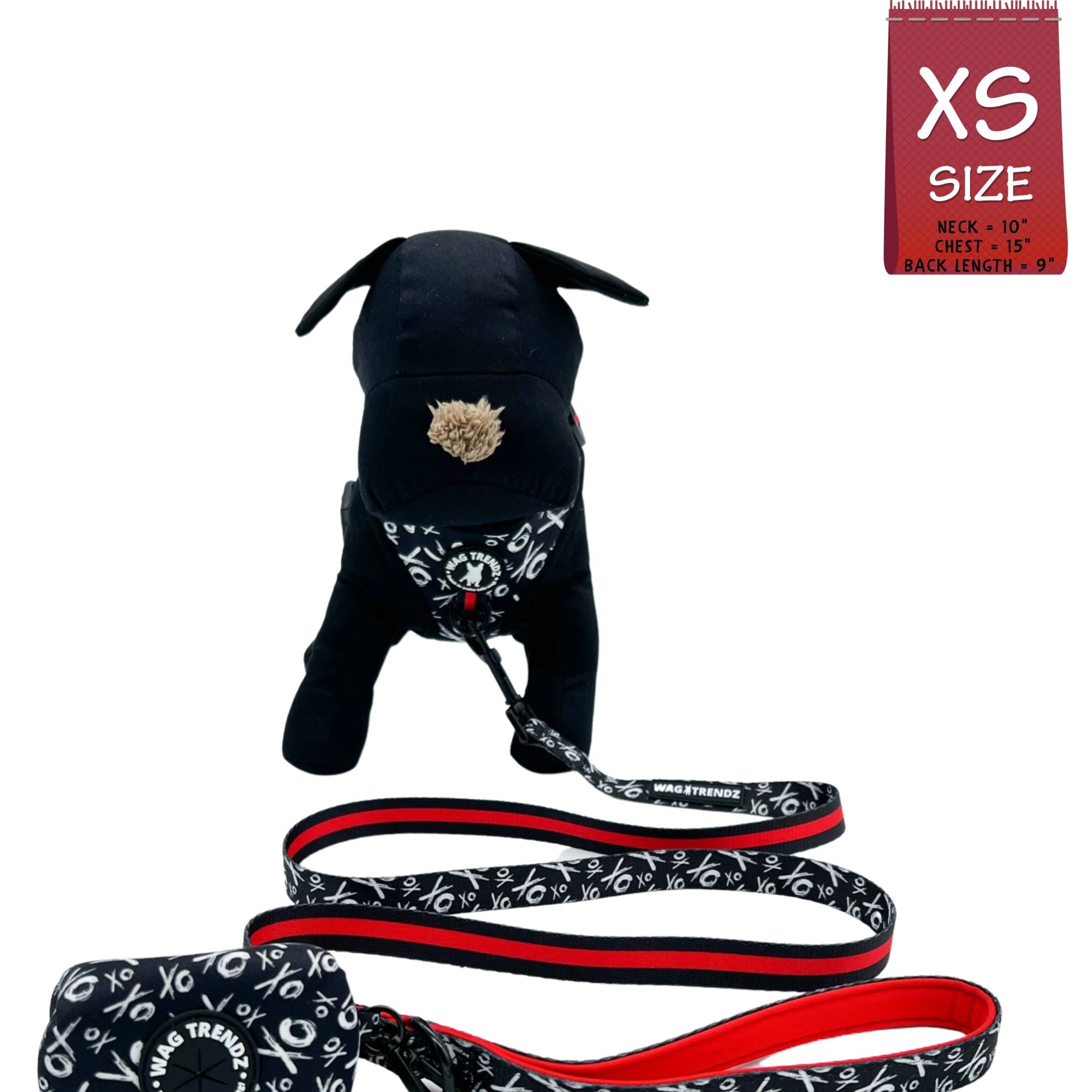 Dog Collar Harness and Leash Set - Small Dog wearing Dog Adjustable Harness in black and white XO&#39;s with bold red stripe and matching leash and poop bag holder attached - against solid white background - Wag Trendz