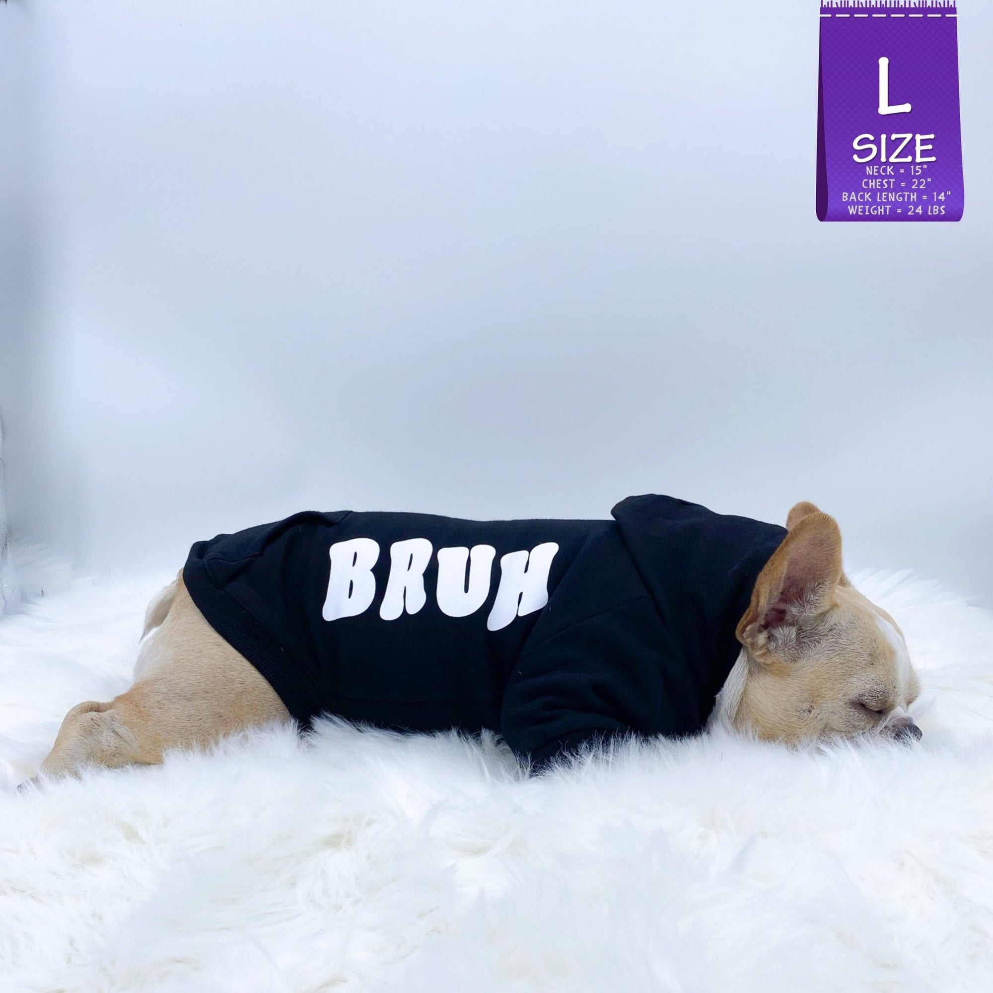 Dog Hoodie - Hoodies For Dogs - French Bulldog wearing &quot;BRUH&quot; dog hoodie in black with white letters down the side - laying down sleeping on a white furry rug - against solid white background - Wag Trendz