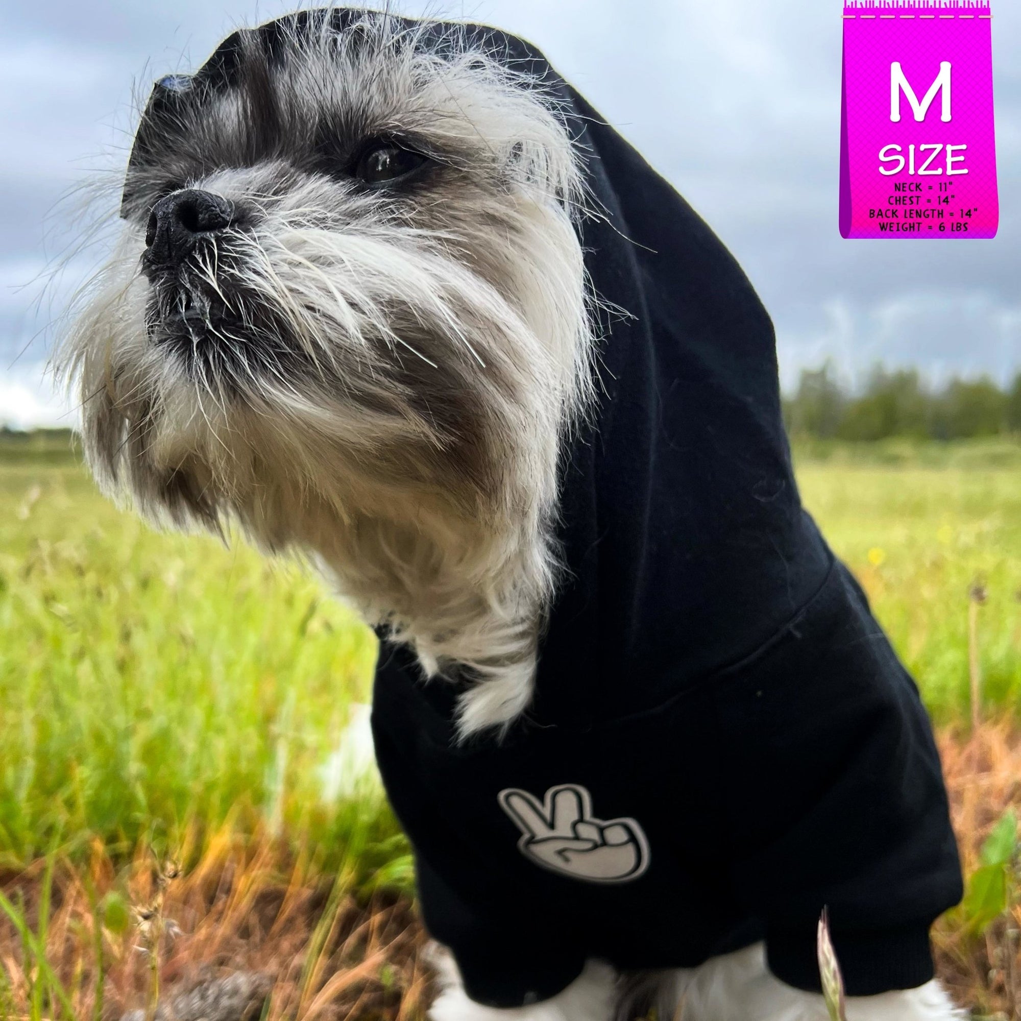Dog Hoodie - Hoodies For Dogs - Shih Tzu mix wearing &quot;Good Life&quot; dog hoodie in black with hood on - front view - with white finger peace sign emoji on front - sitting outdoors in a grassy field - Wag Trendz