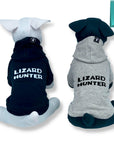 Dog Hoodie - Hoodies For Dogs - Two stuffed dogs one black one white "Lizard Hunter" dog hoodies in gray and black - back views has Lizard Hunter - against solid white background - Wag Trendz