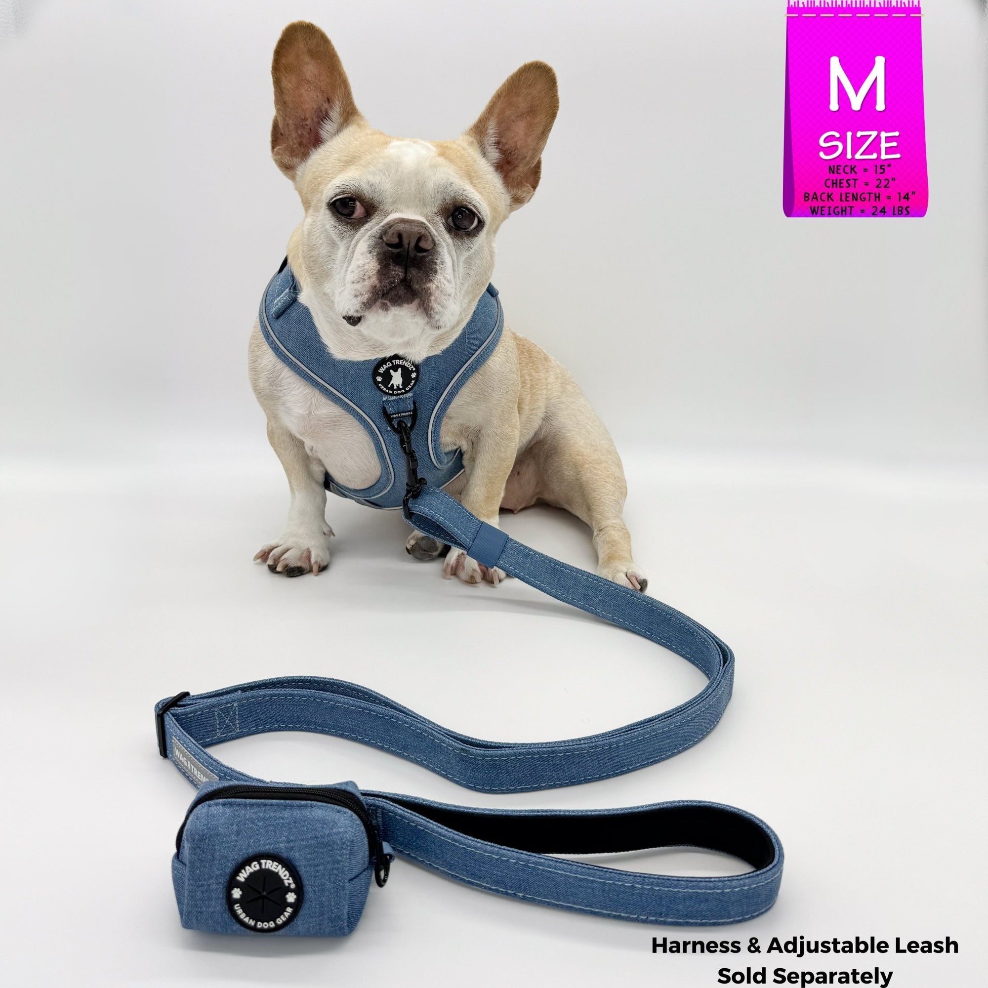 Dog Poop Bag Holder - French Bulldog wearing a medium Downtown Denim dog harness with a leash and poop bag holder attached - blue jean with a black zipper and black rubber logo dispenser on front - against a solid white background - Wag Trendz