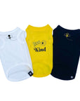 Dog T-Shirt - "Bee Kind" - One white, one yellow and one black with Bee Kind and bee hive on front in yellow and black lettering and swarming bee emoji on front chest - against solid white background - Wag Trendz