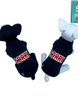 Dog T-Shirt - stuffed dogs one black and one white wearing "Sorry Not Sorry" black dog t-shirt with red and white lettering on back - against solid white background - Wag Trendz