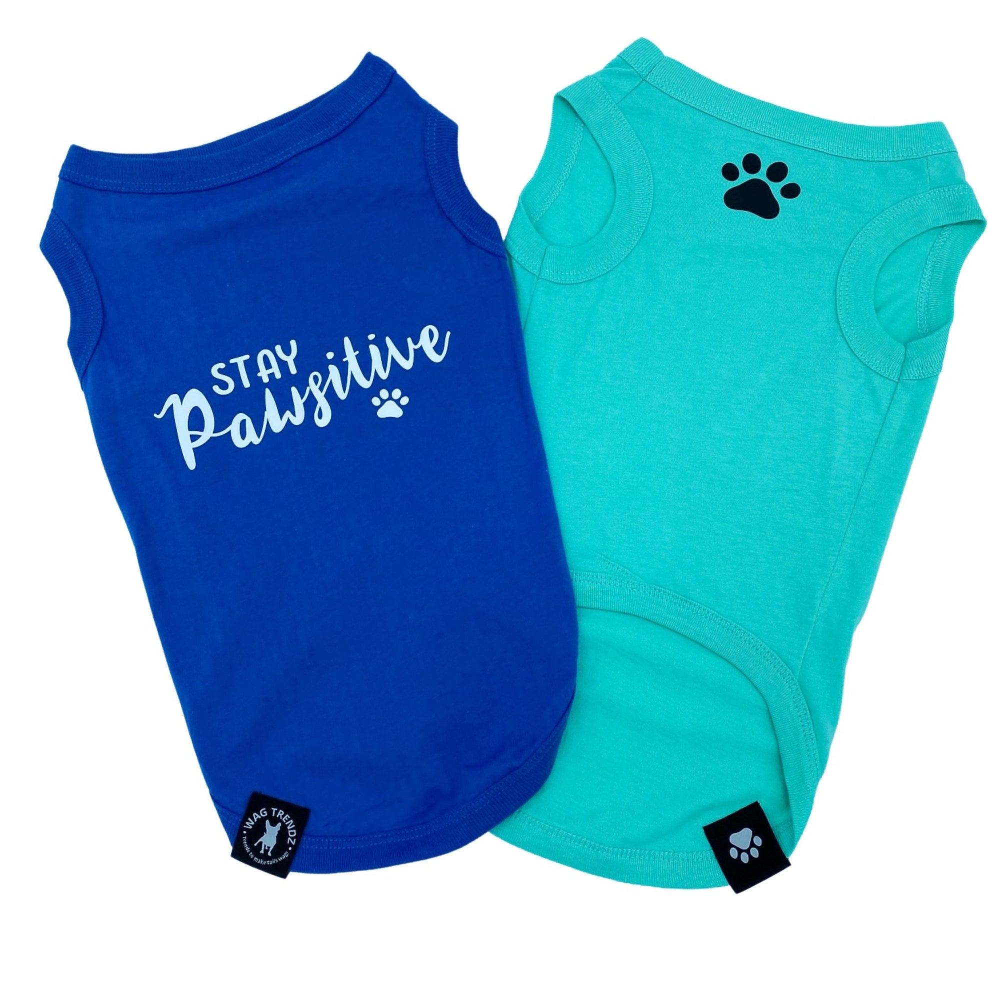 Dog T-Shirt - &quot;Stay Pawsitive&quot; - Royal Blue and Teal dog t-shirt - Stay Pawsitive lettering in white on blue t-shirt and a paw print emoji in black on chest of teal t-shirt - against solid white background - Wag Trendz