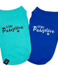 Dog T-Shirt - "Stay Pawsitive" - Teal and Royal Blue dog t-shirts - Stay Pawsitive lettering in black with paw print on teal t-shirt and white lettering on blue t-shirt - against solid white background - Wag Trendz