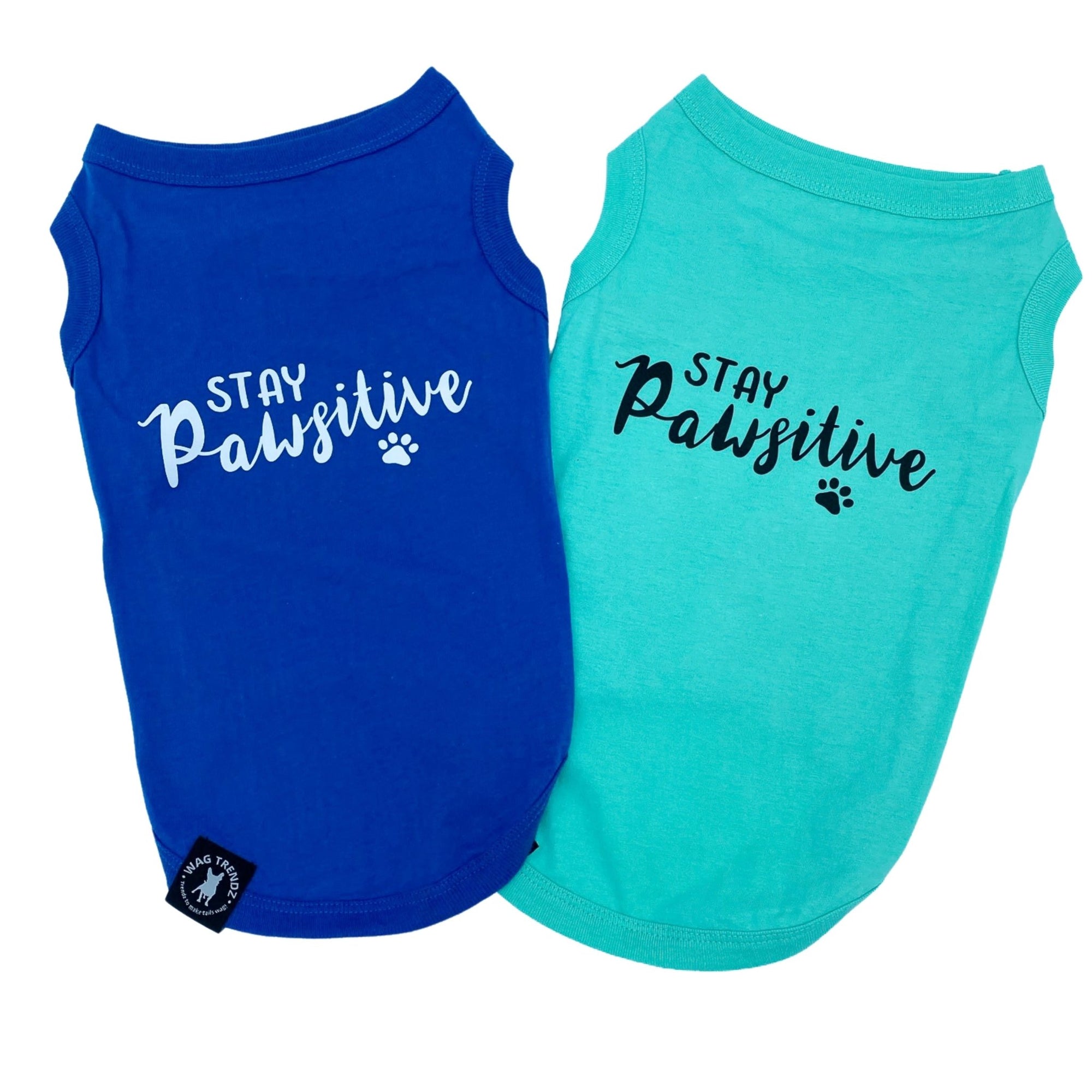 Dog T-Shirt - &quot;Stay Pawsitive&quot; - Royal Blue and Teal dog t-shirts - Stay Pawsitive lettering in white with paw print on blue t-shirt and lettering in black with paw print on teal t-shirt - against solid white background - Wag Trendz